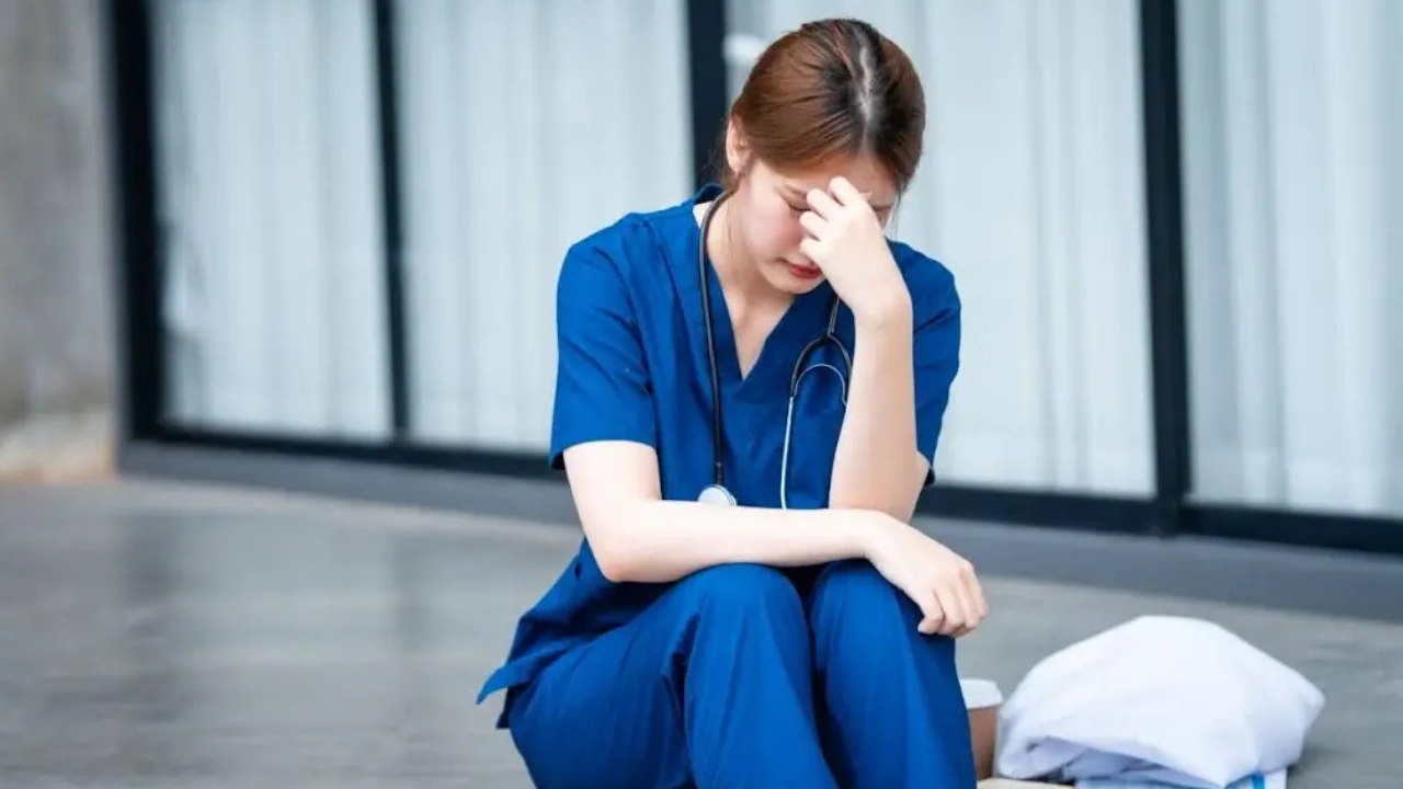 A person feeling emotionally exhausted while supporting others